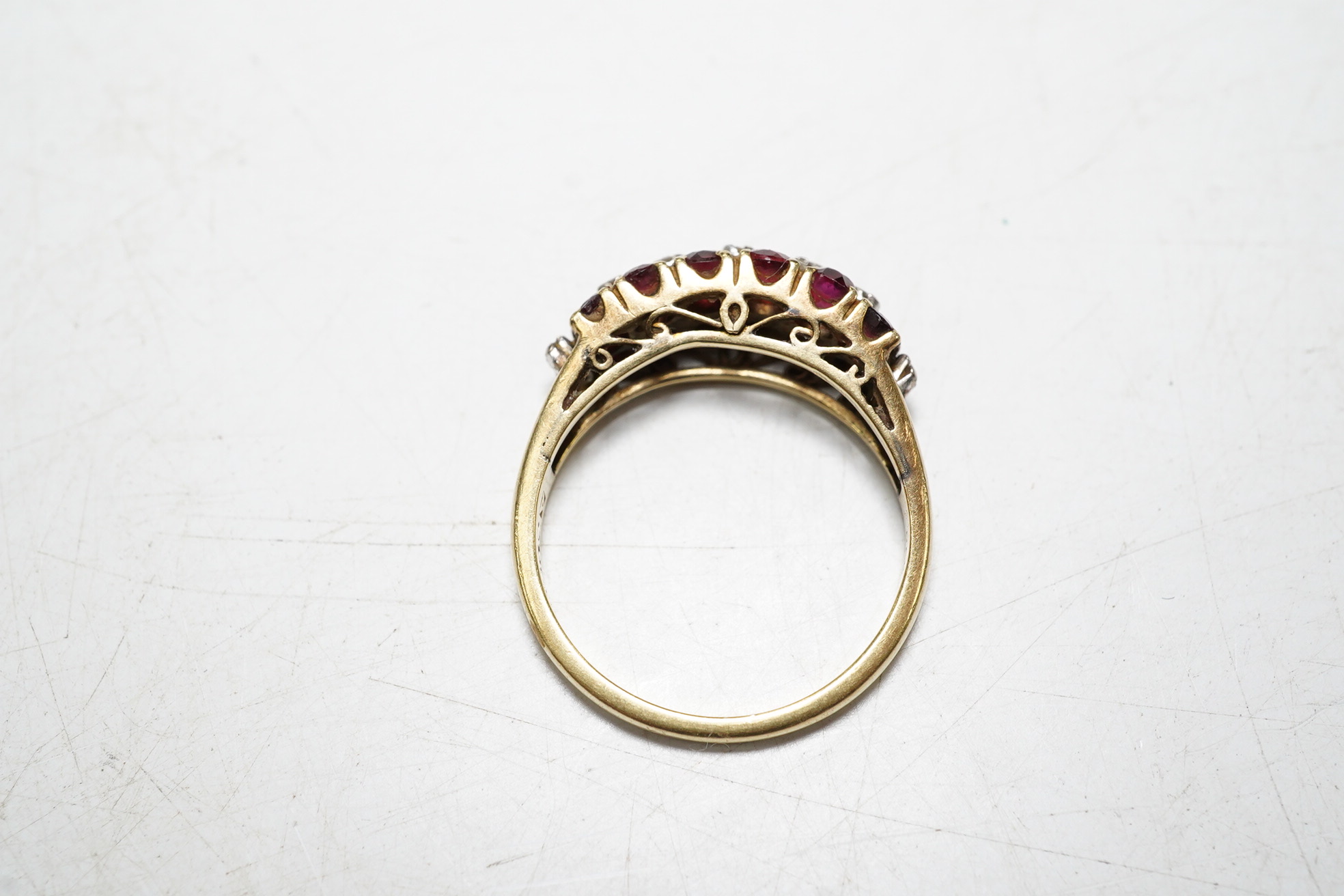 An 18k ruby and diamond set dress ring, one ruby missing, size M, gross 3.7 grams